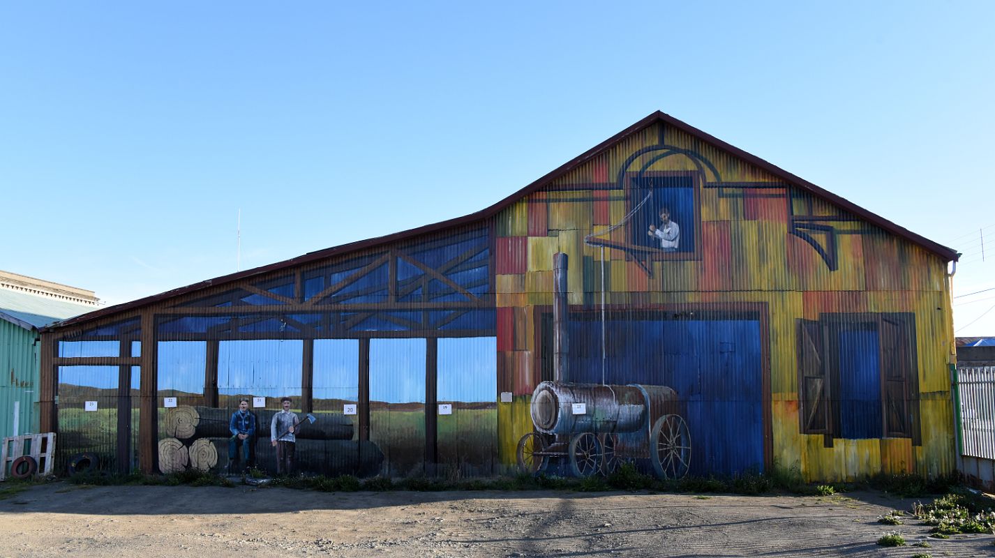 11C Mural Of The Wood Cutters On Building Wall Along Avenida Costanera Waterfront Area Of Punta Arenas Chile